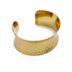 Brass Bracelet - This hammered brass cuff boasts a fascinating texture, a modern concave form, as well an elegant sheen thanks to your choice of electroplated 18k gold or Rhodium silver. Slightly flexible, the cuff can bend to fit most wrist sizes. Modern Hammered Cuff Bangle, Modern Hammered Gold Cuff Bracelet, Modern Gold Hammered Cuff Bracelet, Modern Hammered Cuff Jewelry, Gold Hammered Cuff Bracelet Bangle, Modern Hammered Yellow Gold Bangle, Modern Hammered Bangle, Elegant Hammered Cuff Bangle, Elegant Hammered Cuff Bracelet As Gift