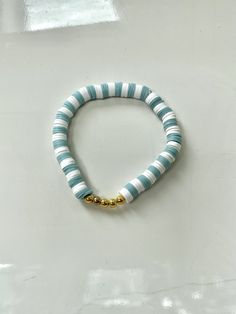 This bracelet is made out of stretchy string and clay beads. It's such a coastal and beachy bracelet, especially for the boardwalk! All orders will recieve 2 stickers and a ring for free. Adjustable Beachy Beaded Bracelets For Everyday, Heishi Beaded Bracelets For Everyday Summer Wear, Everyday Heishi Beads Bracelet For Summer, Beach Bracelet With Letter Beads, Everyday Heishi Beads Bracelets For Summer, Stackable Casual Beaded Bracelets For Summer, Casual Stackable Beaded Bracelets For Summer, Adjustable Heishi Bead Strand Bracelets, Everyday Heishi Beads Friendship Bracelets For Summer