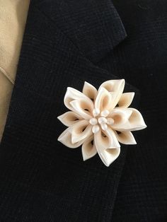 "Men's lapel pin. The lapel pin is made out of satin and organza ribbons in the Japanese kanzashi technic. The flower measures approx. 2.5\" across.  This listing is for one lapel pin in IVORY color. The lapel pin is handmade with top quality materials and made to last. I craft it from my home studio. Please continue to check out other items in my shop. I love custom orders so please convo me for any questions. Thanks for stopping by!" Elegant Cream Brooches For Formal Occasions, Classic White Brooches For Formal Occasion, Classic White Brooch For Formal Occasions, Classic White Lapel Pin For Formal Occasions, Elegant Formal Brooches With Handmade Flowers, White Flower Lapel Pin For Formal Occasions, Elegant Brooches With Handmade Flowers As Gift, Elegant White Lapel Pin For Wedding, Elegant Handmade Flower Brooches For Gifts