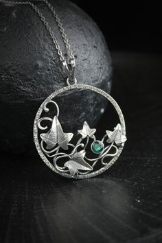 ITEM DESCRIPTION: The size H 4 cm x W 4 cm Weight - 5 g. You can buy it with a silver chain or without it, and choose different stones. I made this plant pendant of sterling silver 925 and hydrothermal emerald. It looks like dainty elven jewelry with natural ivy leaves. Of course, I made these leaves of silver too, but added realistic texture on them, so they look alive. This handmade necklace will come to you in a gift box - ready for gifting. The parcel will be sent 1-2 days after payment. Del Nature-inspired Sterling Silver Jewelry With Large Pendant, Silver Round Pendant Jewelry With Nature-inspired Style, Silver Nature-inspired Round Pendant Jewelry, Handmade Sterling Silver Botanical Necklace, Nature-inspired Sterling Silver Pendant Jewelry, Nature-inspired Sterling Silver Pendant Necklace, Nature-inspired Sterling Silver Leaf Necklace, Nature-inspired Leaf Shape Sterling Silver Jewelry, Nature-inspired Sterling Silver Birthstone Jewelry