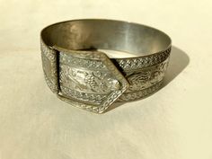 vintage bracelet with unique design * metal silver wash over brass * embossed leaf decoration * flexible * metal band is 3/4" * clasp comes down over nothing to hold closed * closed measures 2 1/4" Leaf Decoration, Buckle Bracelet, Vintage Bracelet, Leaf Decor, Metal Band, Vintage Bracelets, Metal Bands, Unique Vintage, Unique Design