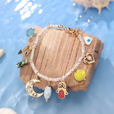 Capture the essence of summer with this unique Evil Eye Colorful Beaded Bracelet! Featuring a combination of multi-colored elements and a shining evil-eye, it is perfect for those who believe in the power of good luck. Adorable and pastel, this bracelet is a must-have for warding off misfortune and bringing a touch of the sea to your style. DETAILS Plating: 18K Gold Materials: 18K Gold on Brass, Natural Stones, Glass Beads Measurements: Length: 7.48"(19cm) + Extender: 1.96"(5cm) Weight: 15g Spiritual Crystal Bracelet With Colorful Beads For Festivals, Bohemian Beaded Charm Bracelet For Beach, Bohemian Charm Bracelet With Round Beads For Beach, Spiritual Beaded Crystal Bracelet For Beach, Bohemian Gold Crystal Bracelet For The Beach, Bohemian Gold Crystal Bracelet For Beach, Bohemian Evil Eye Beaded Bracelets For Jewelry Making, Bohemian Beaded Evil Eye Bracelets For Jewelry Making, Bohemian Beaded Bracelets For Jewelry Making With Evil Eye