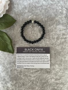 "Black onyx bracelet, Black onyx is a powerful protection stone that works to absorb negative energy. It aids in the healing of past pain, giving one the courage to start a new journey. I have hand made this lovely bracelet with 6mm beads and made to size 6\" length The bracelet also comes with the card as pictured showing the meaning of the stone If you require a different size please message and I will, try and help. ❤️ (Not suitable for under 3 years of age)" Black Onyx Meaning, Onyx Meaning, Bracelet Meaning, Crystal Healing Chart, Bracelets With Meaning, Black Onyx Bracelet, Dream Book, Black Onyx Stone, Onyx Bracelet