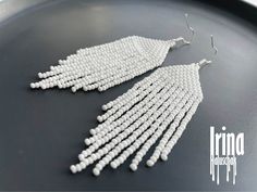 Beautiful beaded modern white earrings with fringe. Very lightweight. Measurements: Length - 2,8 inches (7 cm) Width - 1 inch (2,5 сm) Materials: medical steel, hypoallergenic hooks Czech glass beads Nylon Thread Patience and Creativity .. ready to be given away ! Contact me if you have any questions. I will be happy to answer :) More necklaces from glass or stones: https://www.etsy.com/shop/IrinaHaluschak?ref=seller-platform-mcnav§ion_id=17111035 Beaded earrings: https://www.etsy.com/shop/Irina White Beaded Fringe Long Drop Earrings, White Long Drop Jewelry With Beaded Fringe, White Long Drop Beaded Fringe Earrings, White Fringe Tassel Drop Earrings, White Tassel Chandelier Drop Earrings, White Fringe Beaded Dangle Earrings, White Beaded Fringe Drop Earrings, White Fringe Dangle Chandelier Earrings, White Fringe Chandelier Dangle Earrings