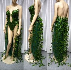 the mannequin is covered in green ivy