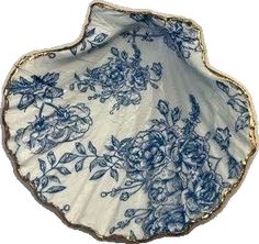 a blue and white plate with flowers on it