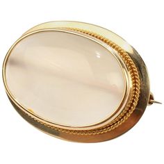 A fine vintage gold and moonstone cabochon brooch. With a large moonstone gemstone bezel set in 10k gold. The finely polished moonstone cabochon has a lovely milky opacity and a small brown inclusion at 7 o'clock on the dial. Simply a fine retro brooch! Date: 20th Century Overall Condition: It is in overall very good, as-pictured, used estate condition with some very fine & light surface scratches and other signs of expected light wear consistent with age. Fineness: Marked 10k to the reverse. Me Art Deco Brooch, Antique Brooches, Diamond Brooch, Cameo Brooch, Gold Brooches, Rock Crystal, Moon Stone, Baroque Pearls, Natural Pearls