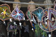 several decorative items hanging from a wooden pole