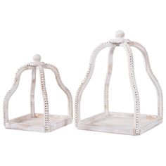 pair of white glass candle holders with beaded details