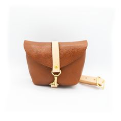 British Tan Ready to join the club, or here to add another color to your collection? Our best selling bag is as versatile as they come -- wear it cross body, across your hips, at your natural waist, or throw it over your shoulder. Tuck it under your arm when you're on that crowded train or at that concert. Whatever your next adventure, this is the bag that will go with you. Features:• Full grain leather bag, adjustable waist strap, and solid brass hardware. Measures:• 7.5in wide, 5in tall, 1.5in deep. 3in x 5in interior pocket. • Shorter strap adjustable total length from 32in - 44in• Longer strap adjustable total length from 44in - 56in Everyday Leather Shoulder Bag With Belt, Everyday Crossbody Belt Bag With Removable Belt, Versatile Everyday Bag With Key Leash, Brown Shoulder Bag With Removable Belt For Travel, Leather Crossbody Shoulder Bag With Belt, Modern Brown Bag With Belt Detail, Brown Pouch Shoulder Bag With Removable Belt, Everyday Pouch Shoulder Bag With Belt Detail, Brown Bags With Belt For Everyday Use