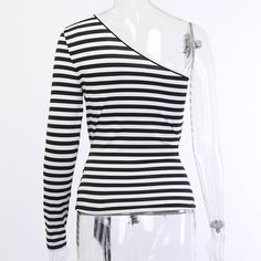 Material: COTTON Decoration: Hollow Out Pattern Type: Striped Sleeve Length(cm): Full Sleeve Style: REGULAR Model Number: 90419 Fabric Type: Broadcloth Collar: Asymmetrical Clothing Length: Short Style: Casual color: White,Black,Stripe season: Autumn style: Fashion,Casual,Streetwear Black Stretch One Shoulder Top With Long Sleeve, Spring Cotton Top With Asymmetrical Neckline, Casual Black Stretch One-shoulder Top, Black Stretch Casual One Shoulder Top, Casual Tops With Asymmetrical Neckline, Casual Fitted Black One Shoulder Top, Casual Black Fitted One Shoulder Top, Casual Fitted One-shoulder Top In Black, Casual Fitted One Shoulder Black Top