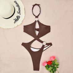 Indulge in allure with our Sultry Solid Hollow Out Monokini. This tantalizing one-piece swimsuit features intricate cut-out detailing that accentuates your curves in all the right places. Crafted from high-quality materials, it offers a perfect balance of comfort and sensuality, making it an ideal choice for poolside lounging or beach escapades. Embrace elegance and confidence as you make a splash in this statement-making swimsuitPattern: Solid colorWith Steel Bracket: With chest pad without ste Party Swimwear With Hollow Out Design, Party Hollow Out Swimwear For Beach Season, Cutout Halter Neck Bodysuit For Swimming, Party Swimwear For Beach Season With Hollow Out, Party Swimwear With Hollow Out For Beach Season, Cutout Halter Neck Bodysuit For Pool, Halter Neck Cutout Bodysuit For Pool, Beachwear Bodysuit With Halter Neck And Cutout, Beachwear Bodysuit With Cutout Halter Neck