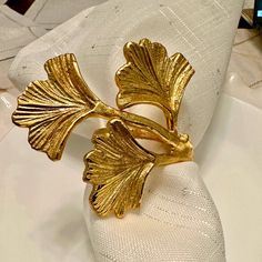 a napkin with a gold leaf on it