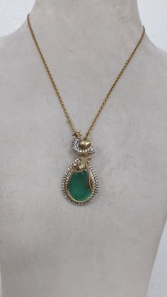 Its unique pendent design with lab grown emerald and moissanite in 925 silver with chain Rhodium-Antique Anti Tarnish gr wt-19.248gms length of pendent -50mm length of chain- 17inches adjustable emerald-9.28cts 925 stamp.. For any query please message us.