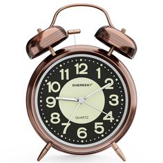 an alarm clock with two hands and numbers on the face is shown against a white background