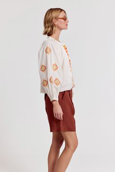 Our best-selling Minka Shirt has intricate embroidery in rich colors of the season. Loose, blousy, and in our crisp poplin.

 Rochelle Behrens reimagined how shirts should fit and feel. Our patented No Gape® button technology, seamlessly designed into every shirt and shirtdress we design, eliminates blouse gape. Finally say bye-bye blouse gape, and hello to The Shirt.

  
 * Imported 
 * 100% Cotton Orange Embroidered Cotton Blouse, Casual Orange Embroidered Blouse, Orange Cotton Blouse With Floral Embroidery, Long Sleeve Orange Top With Floral Embroidery, Orange Long Sleeve Blouse With Floral Embroidery, Orange Floral Embroidered Long Sleeve Top, Fall Cotton Blouse With Multicolor Embroidery, Fall Multicolor Embroidered Cotton Blouse, Fall Cotton Blouse With Geometric Embroidery