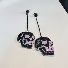 Description: Black And Pink Skull Earrings Condition: Brand New! *Design Is High Quality* These Items Are Individually Made With Love By Me Details: Handmade Item Materials: Acrylic Hypo-Allergenic Stainless Steel Posts Includes Rubber Backs Length: 4.2" Style: Pastel Goth / Cybergoth Care Instructions: Store Out Of Direct Sunlight And Keep Away From Water. It Is Not Recommended To Wear These Earrings In Or Around Water. Edgy Skull Earrings For Parties, Black Skull Print Earrings As Gift, Black Skull-shaped Earrings With Skull Print, Punk Skull Earrings For Party, Edgy Skull-shaped Earrings For Gift, Edgy Skull Shaped Earrings For Gift, Adjustable Black Skull-shaped Earrings, Adjustable Black Skull Earrings, Black Gothic Earrings With Skull Print