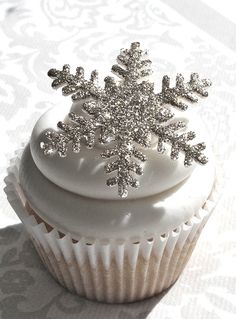 there is a cupcake with a snowflake on top