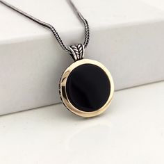 The necklace is made of 925 sterling silver. It is a very useful and stylish accessory. Product features The product is sent with free shipping with its box and bag. Made of 925 Sterling Silver - Pendant Diameter: 25 x 25 mm - Chain: Length 55 cm - Stone: Onyx The figures you want can be made instead of the figure in the necklace. It can be customized with the shapes, texts and figures you want. All products come in a special gift box. If you can't see your size, please inquire, we can produce y Classic Black Necklaces With Round Pendant, Classic Black Necklace With Round Pendant, Classic Black Pendant Necklace, Classic Black Round Pendant Necklace, Classic Onyx Necklace With Black Enamel, Round Onyx Necklace With Black Enamel, Black Enamel Onyx Round Pendant Necklace, Black Sterling Silver Round Necklace, Black Sterling Silver Necklace With Round Pendant