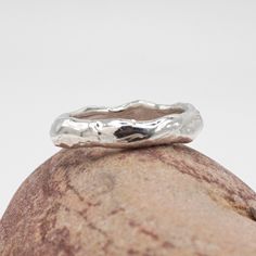 A simple, chunky ring with a molten silver effect.  Inspired by the flow of volcanic molten rock & metal.  Each ring is made to order and totally unique. A perfect ring to wear alone, stack or as an alternative wedding band. 100% Recycled Silver  Please allow 2-3 weeks for your ring to be made. For more information about me and the Jewellery I create, please visit my website - www.melissayarlett.co.uk Molten Rock, Rock Amp, Alternative Wedding Bands, Chunky Ring, Etsy Wedding Rings, Rock Metal, Chunky Rings, Recycled Silver, Silver Band Ring