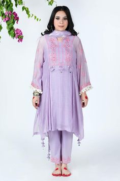 Lilac mulmul chanderi kurta with pink thread embroidery, mirror work embellishment, pleated front panel and side slits. Paired with a cotton embroidered Pakistani pants, lehriya crinkled dupatta and sleeveless slip.
Component: 4
Pattern: Embellishment and Embroidered
Type Of Work: Mirror and Thread Work
Neckline: Notched Round Neck
Sleeve Type: Three Quarter
Fabric: Kurta: Mulmul Chanderi, Cotton
Color: Purple
Other Details: 
Tassels details on kurta)
Gota work stripes on dupatta
Pom-Poms tassel Spring Chanderi Salwar Kameez With Mirror Work, Spring Chanderi Anarkali Set With Mirror Work, Spring Chanderi Palazzo Set With Mirror Work, Festive Cambric Kurta With Mirror Work, Cambric Dupatta With Mirror Work, Festive Traditional Wear With Mirror Work In Cambric, Eid Cambric Sets With Mirror Work, Cotton Silk Lawn Suit With Mirror Work, Spring Chanderi Dupatta With Mirror Work