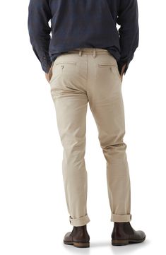 Stay cool in these work-to-weekend chino pants that have a versatile color and a hint of stretch for added comfort. 98% cotton, 2% elastane Machine wash, line dry Imported Cotton Chinos With 5-inch Inseam And Pockets, Slim Fit Chinos For Business Casual, Cotton Tapered Leg Pants With Straight Fit, Cotton Ankle-length Chinos For Work, Ankle-length Cotton Chinos For Work, Casual Tapered Leg Dress Pants, Workwear Chino Cotton Twill Straight Leg Bottoms, Slim Fit Chinos In Chino Cotton Twill For Spring, Slim Fit Tapered Leg Chinos For Workwear