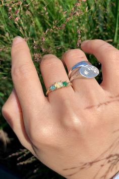 This Earthy Opal Engagement Ring is the perfect way to wrap your hands in love. These Rings are made with genuine Raw free-formed Opal, emerald and aquamarine in their natural state. It's crafted in a Solid Sterling silver/14k/18k Gold Specification: Gemstone: Raw Opal, emerald, aquamarine Center Opal Size: 4.5mm*5.5mm Materials: Solid Sterling Silver, Solid 14k/18k Gold Style: Engagement Ring *Gems: The raw gems natural hues vary, adding an organic touch to your ensemble. I'll try to select the Multi-stone Emerald Diamond Ring For May Birthstone, Fine Jewelry Aquamarine Three Stone, Three Stone Aquamarine Jewelry As A Gift, Three Stone Aquamarine Jewelry For Gift, Three-stone Aquamarine Jewelry For Gift, Green Aquamarine Rings For Anniversary, Adjustable Green Multi-stone Ring, Multi-stone Emerald Ring As A Gift, Fine Jewelry Emerald Promise Ring With Birthstone