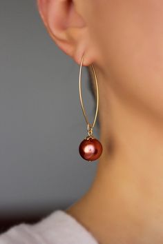 Lovely feminine earrings with bright carmine red color pearl coated glass 12 mm beads, gold tone bead caps and gold tone stainless steel oval shape earring hooks. Earring hooks are from nickel free and lead free metal. *The total lenght of earrings is about 56 mm including earring hooks. Perfect jewelry for everyday wear or a wonderful gift! Other earrings of my shop you can see here: https://www.etsy.com/shop/NaTavelli?section_id=13757927 Thanks for visit. Elegant Red Hoop Earrings, Elegant Red Beaded Hoop Earrings, Pearl Earrings Long, Feminine Earrings, Red Pearl, Pearls Earrings, Earrings Big, Gold Dangle Earrings, Big Pearl