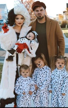 the family is dressed up in dalmatian costumes