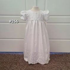 White Silk Baby/Toddler Dress. Embellished With Embroidered, Beaded Flowers. Gathered Short Sleeves And Bodice. Satin Ribbon Ties In The Back. 4 Layered Underskirt With Tulle. Buttons All The Way Up The Back. Perfect For A Flower Girl, Baptism, Christening Or Baptism. Fouger Brand. New With Tags Still Attached. Available In Size 18 Months And Size 24 Months. Fitted Baptism Dress For Spring Pageant, Fitted Baptism Dress With Floral Applique For Dress-up, Fitted Short Sleeve Baptism Dress For Pageants, Fitted Short Sleeve Baptism Dress For Pageant, Pageant Baptism Dress With Floral Applique, White Floral Applique First Communion Dress, White Floral Embroidered Dress For Baptism, White Baptism Dress With Floral Embroidery, White Floral Embroidered Baptism Dress