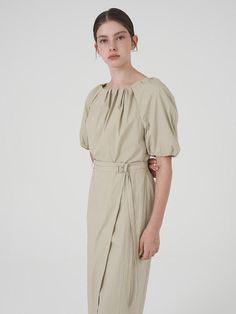 This is a modern and feminine dress by on&on that is made out of high quality fabric. With unique design detail and trendy mood, you can style it for both your casual and refined daily outfit.- Voluminous silhouette with shirring- Can be styled as off shoulder- Feminine and modern mood Elegant Cotton Midi Dress With Gathered Sleeves, Ruched Puff Sleeve Dress For Work, Chic Ruched Midi Dress For Daywear, Spring Workwear Ruched Puff Sleeve Dress, Chic Cotton Midi Dress With Pleated Waist, Cotton Midi Dress With Gathered Sleeves For Work, Chic Cotton Puff Sleeve Dress With Pleated Sleeves, Modern Spring Midi Dress For Daywear, Chic Daywear Midi Dress With Pleated Sleeves