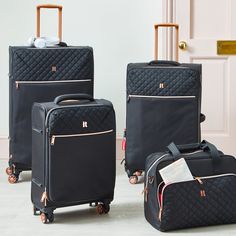 Designed with eight wheels for superior wheel control, this suitcase by IT Luggage features an ergonomic handle for superior comfort combined with lightweight tubes for added strength. Complete with a unique base structure that has been specially developed to provide additional strength and stability, this suitcase features luxury detailing with a soft touch, quilted panel with rose gold detailing for a luxury finish. Supplied with a 10 year warranty. This suitcase is available in a range of siz Black Suitcase, Luggage Black, One Suitcase, Travel Luggage Suitcases, Luxury Luggage, Travel Bag Set, Things I Need To Buy, Vintage Suitcases, Vintage Luggage