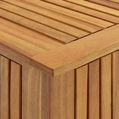 a close up view of a wooden bench with slats on the top and bottom