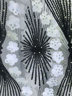 Absolutely Beautiful Embroidery lace with beads and sparkly rhinestone . Color White with black ornaments . Eco- Friendly. Breathable. Width 51”-52”sold by 1 yard. Elegant Embroidered White Tulle Fabric, Elegant White Embroidered Tulle Fabric, Elegant White Embroidered Fabric And Notions, Elegant White Beaded Embroidered Fabric, Elegant White Embroidered Beaded Fabric, Elegant White Embellished Sequin Fabric, White Lace For Spring Party, Elegant White Embroidered Fabric For Summer, Elegant White Sequin Fabric With Intricate Embroidery