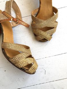 "Vintage 1930s woven gold mesh strappy heels with open toe, ankle strap and sturdy heel. --- M E A S U R E M E N T S --- fits like: us 6.5 | euro 37 | uk 4 insole: 9.5\" ball: 3.2\" heel: 2.25\" brand/maker: n/a condition: excellent, some light wear on ankle straps (see photo) ➸ more vintage footwear http://www.etsy.com/shop/DearGolden?section_id=5800174 ➸ visit the shop http://www.DearGolden.etsy.com ➸ blog | www.deargolden.com ➸ twitter | deargolden ➸ facebook.com | deargolden" Vintage Gold Heels For Summer, Vintage Sandals With Heel Strap And Low Heel, Vintage Evening Sandals With Heel Strap, Vintage Gold Sandals For Evening, Vintage Gold Sandals For Formal Occasions, Vintage Gold Sandals With Round Toe, Retro Gold Open Toe Heels, Vintage Gold Open Toe Sandals, Vintage Ankle Strap Sandals For Formal Occasions