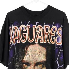 Description:Vintage Jaguares black Resureccion t-shirt, fits x-large.GENDER: mens CONDITION: good - some writing on back of graphic.STYLE: t-shirtERA: 1990sCOLOUR: blackFABRIC: cotton Band Merch T-shirt With Vintage Print For Streetwear, Vintage Black T-shirt With Graphic Design, 90s Vintage Print Black T-shirt, Vintage Black T-shirt With Letter Print, Vintage Concert T-shirt With Text Print, Vintage Text Print T-shirt For Concert, Vintage Halloween Concert T-shirt, Black Casual T-shirt With Vintage Print, Casual Black T-shirt With Vintage Print