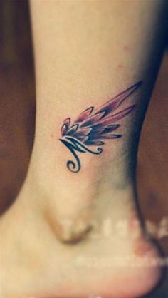 a small tattoo on the foot of a woman