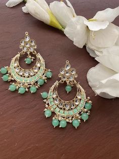 Height = 88 mm || Width = 65 mm Meenakari Design Indo Western Earring Gorgeous kundan, pearls, meenakari contemprory earrings, light weight Highest quality and craftsmanship, Ready to ship from Edison NJ USA Please contact us any questions Green Dangle Chandbalis With Latkans, Turquoise Kundan Chandbali Earrings, Turquoise Kundan Earrings For Festivals, Festive Green Jhumkas For Pierced Ears, Green Bohemian Chandbali Earrings, Festive Green Jhumkas, Traditional Turquoise Danglers For Gift, Festive Kundan Turquoise Earrings, Green Heavy Dangle Chandbalis