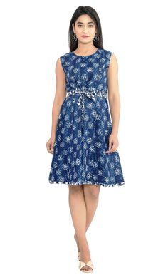 Smart Floral Print Indigo Blue Cotton Dress.  Smart block hand printing.  With contrast matching cotton fabric belt. and stylish bottom lining of contrast fabric, giving stylish and ethnic look. 100 % cotton for keeping you cool every time. Anti static dress. Length - 36 inches. Standard Measurement according to US size 4 Bust-34 inches. Waist-32 Inches Hip-38 inches. Bottom round 2.5 meters. Fitted Casual Block Print Dress, Casual Fitted Block Print Dress, Sleeveless Cotton Belted Dress, Traditional Blue Cotton Dress, Casual Blue Dress With Batik Print, Casual Cotton Block Print Dress, Fitted Blue Dress With Block Print, Blue Cotton Knee-length Dress, Fitted Indigo Cotton Dress