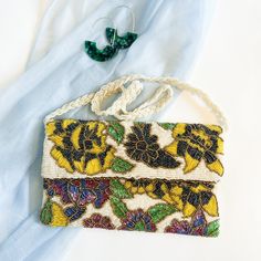 Yellow on White Floral Beaded Clutch   Handbag Size: 10x6 inches One Pocket Magnetic Snap Closure Zipper To Open The Clutch Back And Front Fully Beaded Work Fabric Silk Beaded Chain White Rectangular Celebration Bags, Rectangular Cream Evening Bag As Gift, Rectangular Cream Evening Bag Gift, Multicolor Clutch Bag For Celebration, Beaded Rectangular Clutch For Gift, Handmade White Clutch For Gift, White Handmade Clutch For Gift, Handmade White Clutch As Gift, Beaded Rectangular Clutch As Gift