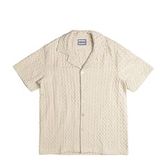 Elevate your casual attire with the Castles Waffle Shirt. Made from 100% premium cotton, this shirt features a unique waffle texture that enhances both style and comfort. The short-sleeve design and button-up front provide a relaxed yet refined look, perfect for any occasion. With a focus on quality and craftsmanship, this shirt offers a versatile addition to your wardrobe, ideal for pairing with jeans or shorts for a stylish ensemble. Key Features: 100% premium cotton Unique waffle texture Short-sleeve design Button-up front Add this chic and comfortable shirt to your collection for a trendy and versatile look. Textured Casual Tops For Loungewear, Summer Waffle Knit Short Sleeve T-shirt, Cotton Camp Shirt With Camp Collar For Loungewear, Cotton Camp Collar Shirt For Loungewear, Cotton Collared Camp Shirt For Loungewear, Beige Relaxed Fit Short Sleeve Camp Shirt, Casual Collared Waffle Knit Top, Beige Relaxed Fit Camp Shirt With Short Sleeves, Textured Cotton Casual Tops