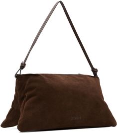 Suede shoulder bag in brown. · Knotted detailing at fixed shoulder strap · Logo embossed at back face · Zip closure · Zip pocket at interior · Suede lining · H7.75 x W15.5 x D6.25 Supplier color: Mahogany Brown Pouch Baguette Bag With Dust Bag, Luxury Brown Baguette Bag With Leather Handles, Brown Shoulder Satchel With Dust Bag, Staud Satchel Bag With Removable Pouch, Staud Satchel Shoulder Bag For Evening, Evening Brown Hobo Bag With Leather Handles, Brown Leather Handle Hobo Bag For Evening, Brown Hobo Bag With Leather Handles For Evening, Staud Bags With Double Handle For Daily Use