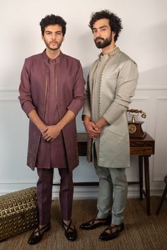 Deep wine jacket with placement embroidery and textured detail. Paired with woven kurta and pant. 
Component: 3
Neckline: Mandarin
Sleeve Length: Three quarter
Fabric: Textured Jacquard
Color: Purple
Patch pocket
Note: Green outfit worn by the other model is not for sale - Aza Fashions Placement Embroidery, Kurta Set For Men, Fabric Textured, Pocket Notes, Jacquard Jacket, Purple Jacket, Green Outfit, Fashion App, Kurta Set