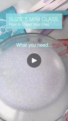 a glass bowl filled with white glitter next to toothbrushes