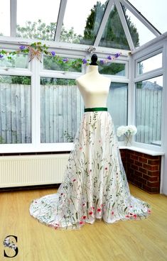 a dress on display in front of a window