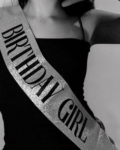 black and white photograph of a woman wearing a tiara with the word brooklyn on it