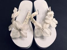 Comfort is the Key with these .. Straps Wrapped Tightly with Satin Ribbon. Layered in Fabric Flowers with detail Rhinestone and Pearls . All Quality  Materials are  used in this Shop! We DO offer Last Minute Rush Orders in the US. Message inbox for  details Elegant Beach Wedding Shoes With Round Toe, White Round Toe Wedding Shoes For Destination Wedding, Elegant Round Toe Wedding Shoes For Beach Wedding, Elegant Round Toe Beach Wedding Shoes, Spring Beach Wedding Shoes With Round Toe, Elegant White Wedding Shoes For Beach Wedding, Elegant White Wedding Shoes For Beach, Elegant White Beach Wedding Shoes, Bride Flip Flops