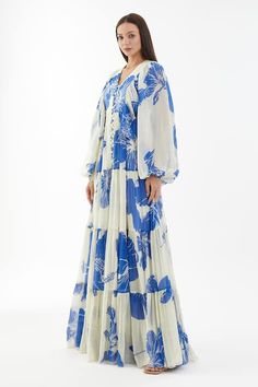 Buy Blue Chiffon Floral V Neck Balloon Sleeve Dress For Women by KoAi Online at Aza Fashions. Floral Print Chiffon Maxi Dress, Potli Button, Floral Print Long Dress, Refined Fashion, Floral Print Dress Long, Balloon Sleeve Dress, Printed Gowns, Chiffon Floral, Blue And White Dress