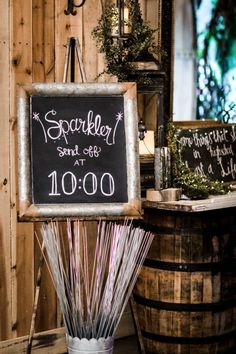 a sign that says sparkler send - off at 10 00 o'clock sitting on top of a barrel