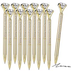 six gold pen with diamonds on each side and the words, love is in the air